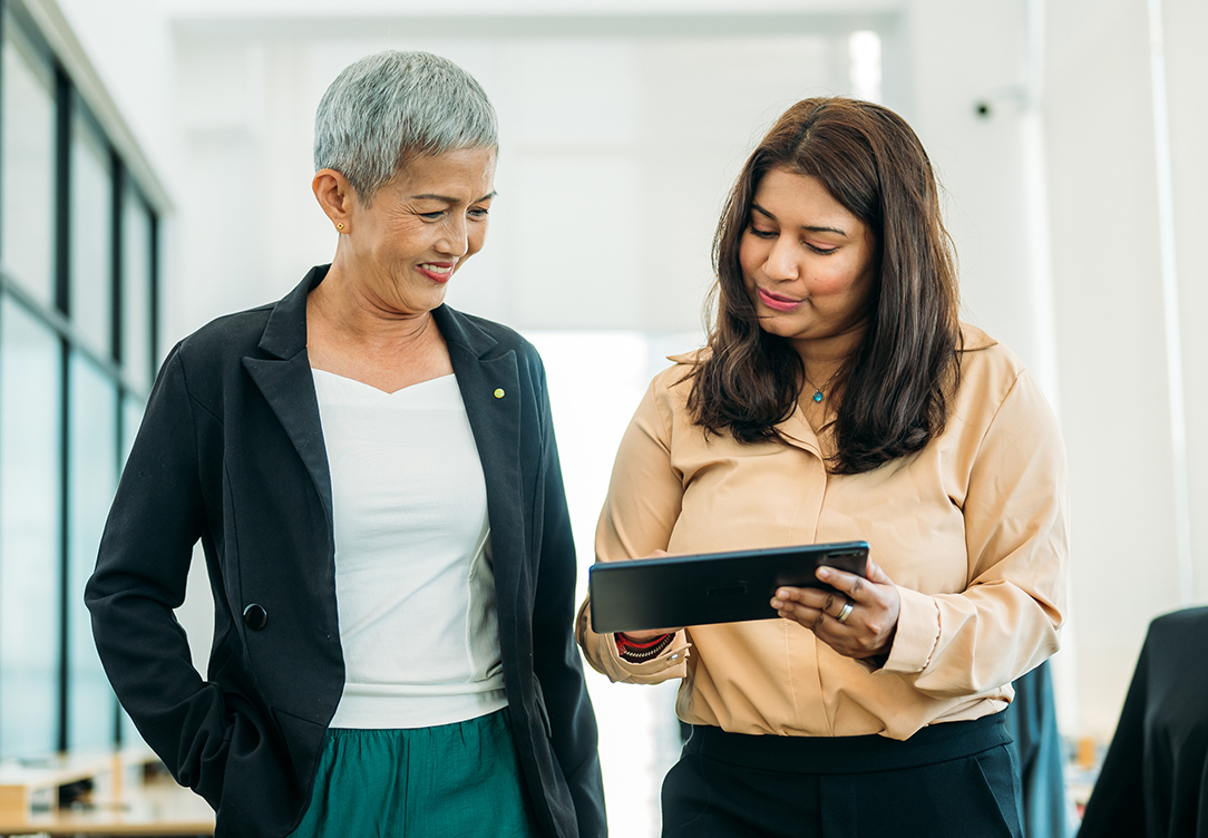 Women looking at nonprofit data for businesses