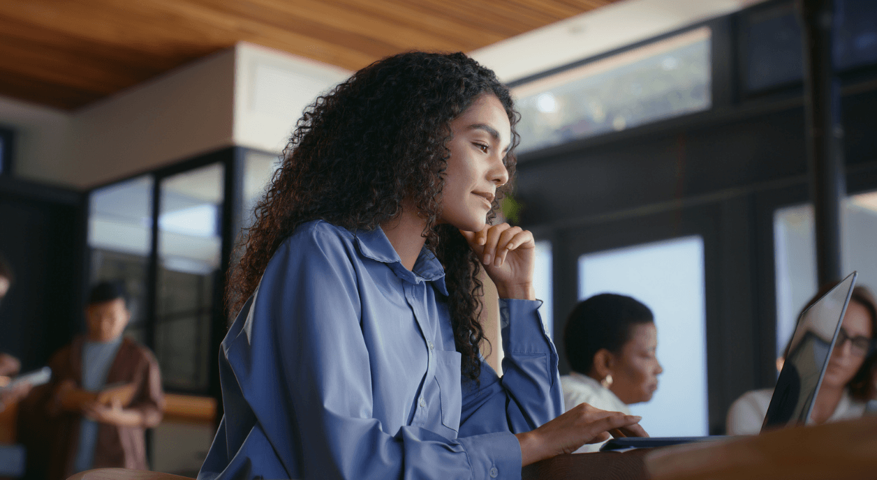 A woman writing a grant proposal.